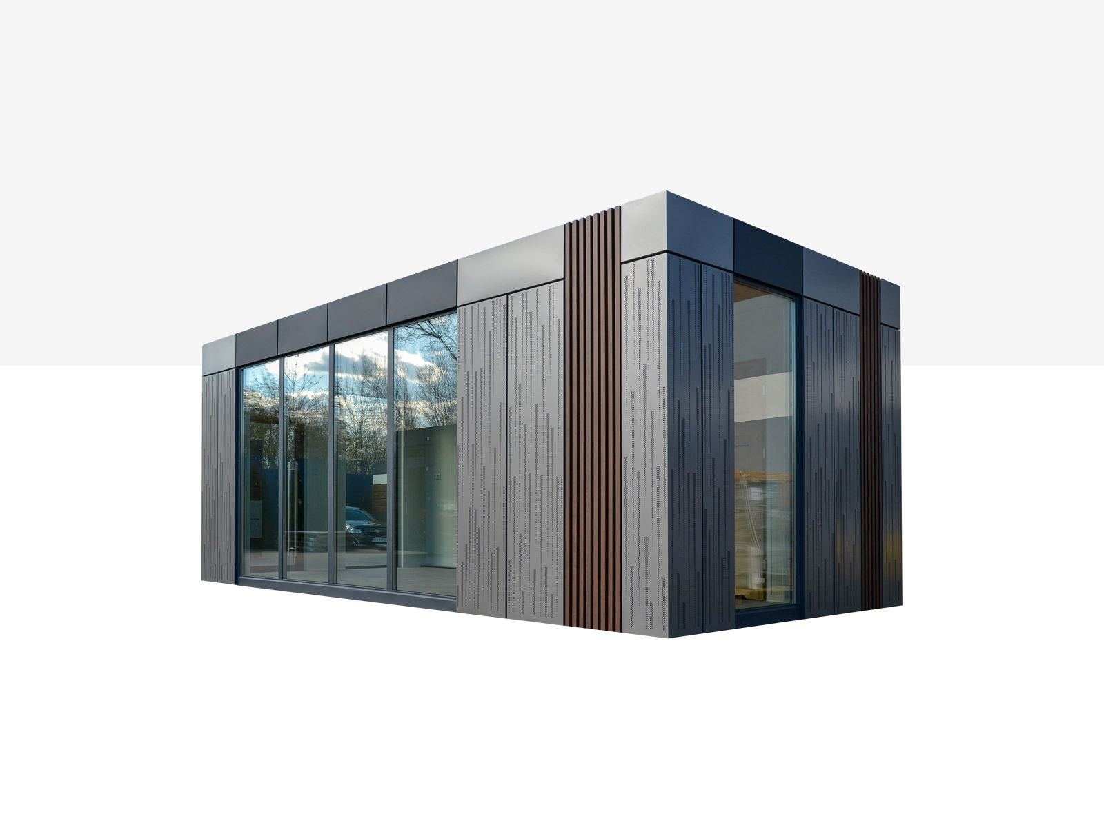 Modern, eenlaags modulair gebouw met grote glasvoorkant en grijze metalen gevel met verticale designelementen      